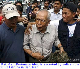 Ret. Gen. Fortunato Abat is escorted by police from Club Filipino in San Juan