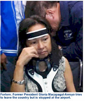 Forlorn. Former President Gloria Macapagal-Arroyo tries to leave the country but is stopped at the airport