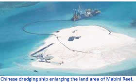 Chinese dredging ship enlarging the land area of Mabini Reef