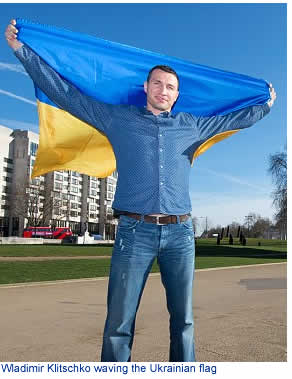 Wladimir Klitschko waving the Ukrainian flag
