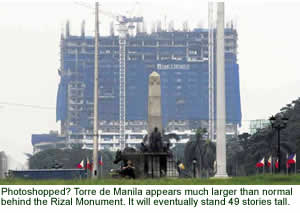 Photoshopped? Torre de Manila appears larger than normal behind the Rizal Monument. It will eventually stand 49 stories tall