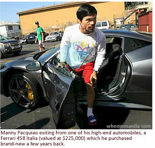 Manny Pacquiao exiting from one of his high-end automobiles, a Ferrari 458 Italia (valued at $225,000) which he purchased brand-new a few years back