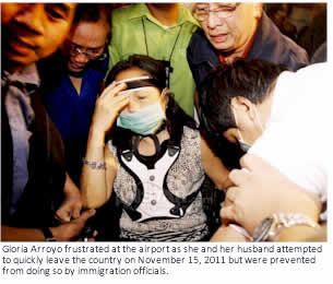 Gloria Arroyo frustrated at the airport as she and her husband attempted to quickly leave the country on November 15, 2011 but were prevented from doing so by immigration officials